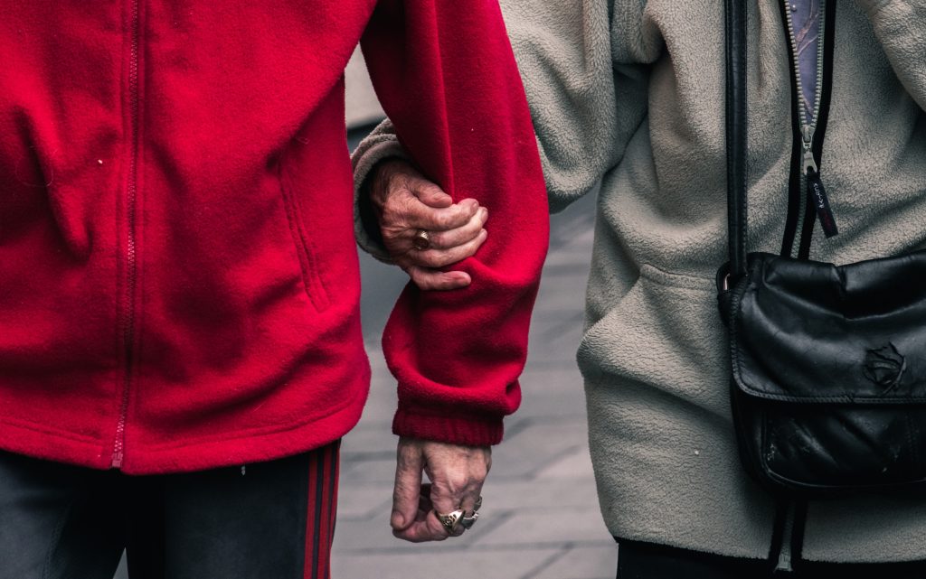 old couple holding hand